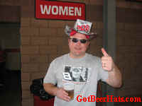 Another happy customer wearing a beer hat checking out the womens restroom